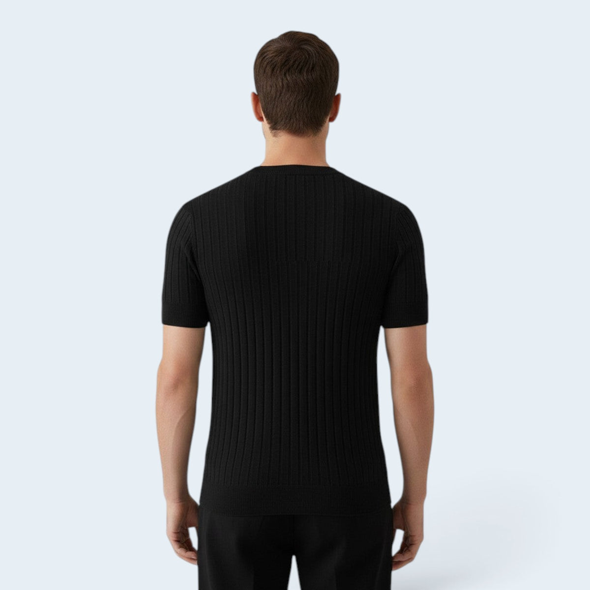Back view of a man wearing a Savrille black short sleeve ribbed knit V-neck shirt with a structured fit.