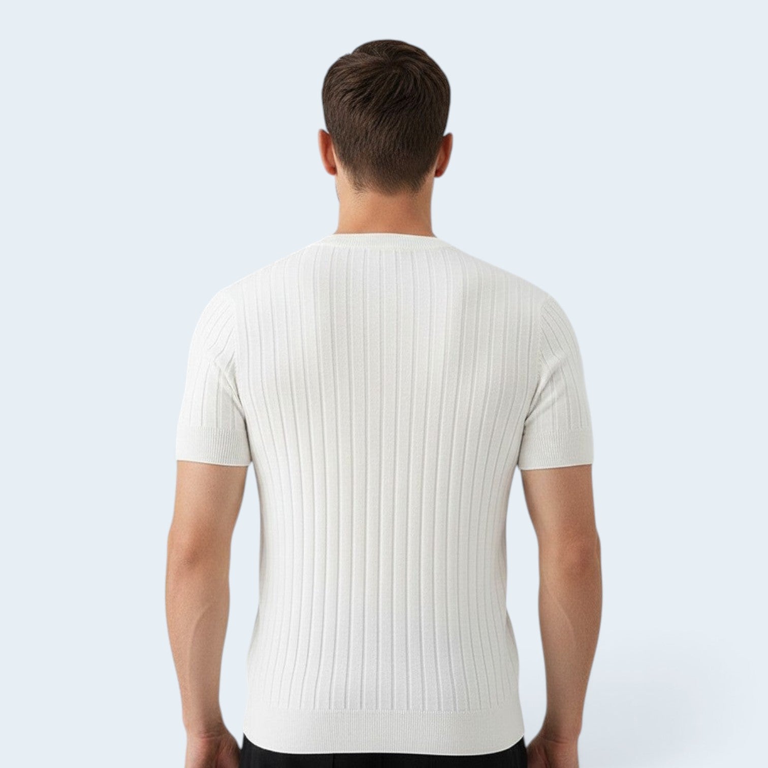 Back view of a man wearing a Savrille white short sleeve ribbed knit shirt with a structured fit.