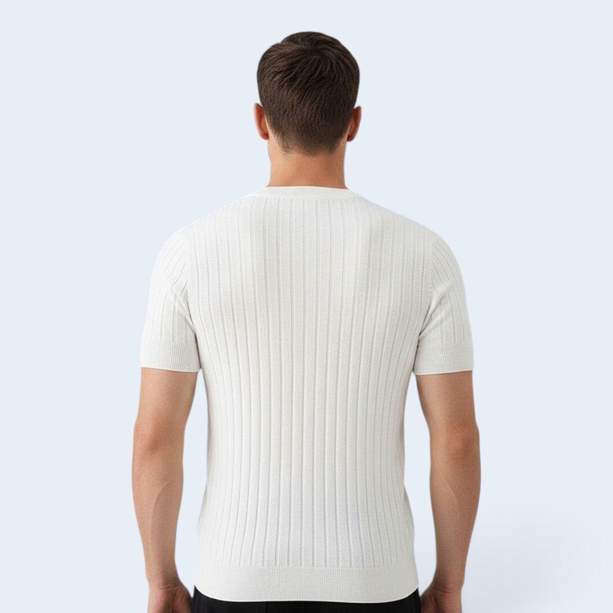 Back view of a man wearing a Savrille white short sleeve ribbed knit shirt with a structured fit.