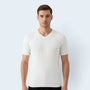A man wearing a white Savrille short sleeve ribbed knit V-neck shirt with a structured fit against a light background.
