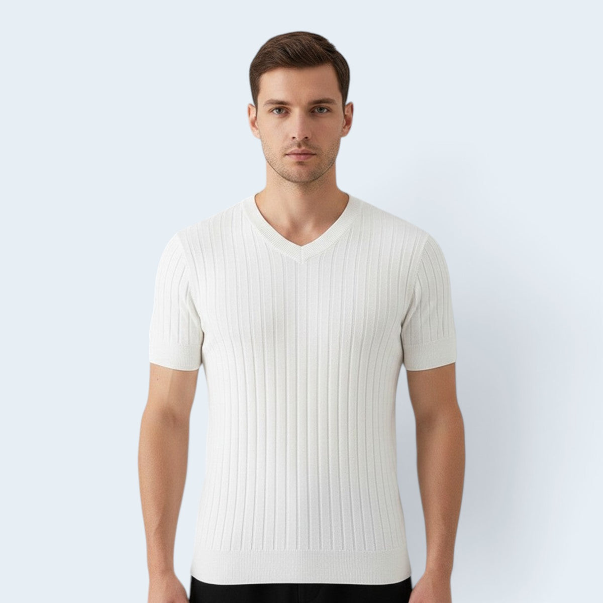A man wearing a white Savrille short sleeve ribbed knit V-neck shirt with a structured fit against a light background.